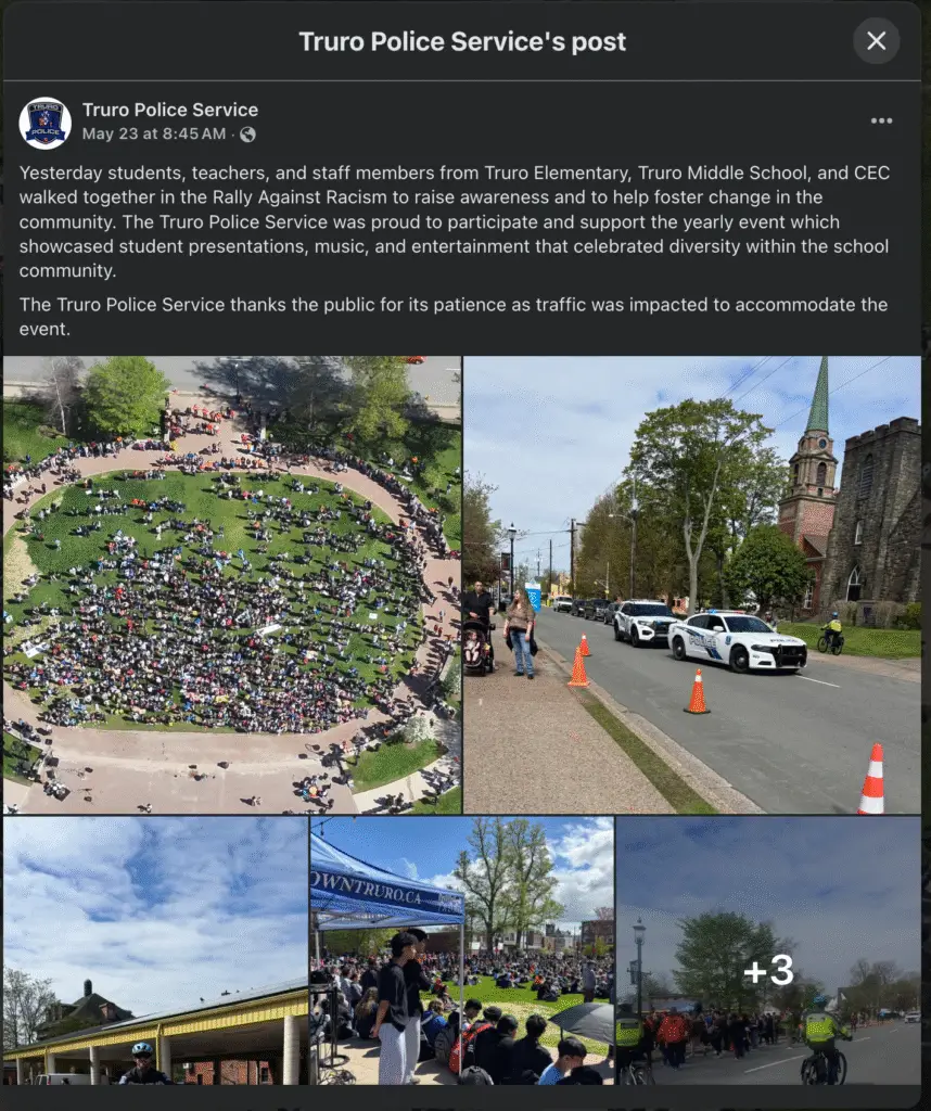 A collage of photos from the Rally Against Racism in Truro, Nova Scotia, showing a large crowd of students seated in a circular pattern on a grassy field, police vehicles and officers managing traffic, and students gathered under tents and walking in procession with police escort. The event features banners, performances, and a visible police presence supporting the event.